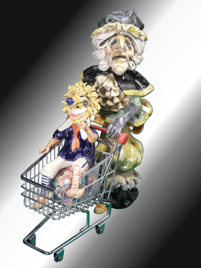 Fasnachtsfigur Alti  Dante mit Kind als Waggis im Wagen 