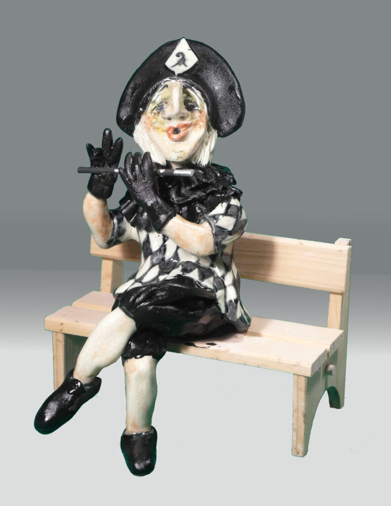  Fasnachtsfigurn Harlekin auf Bänkli