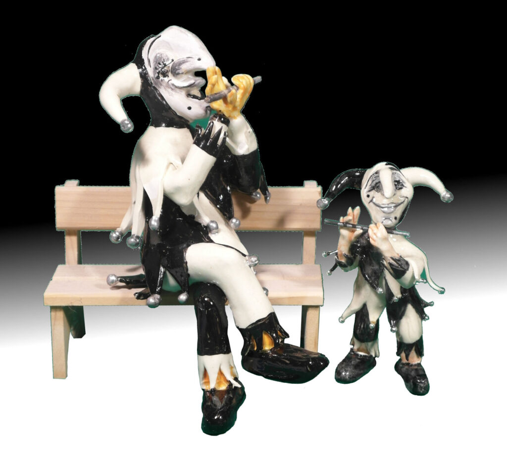 Basler Fasnachtsfigur Ueli auf Bänkli und Kind